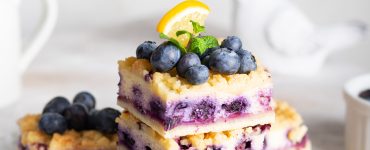 Blueberry pie with cottage cheese on white plate