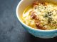 French onion soup in blue ceramic bowl horizontal
