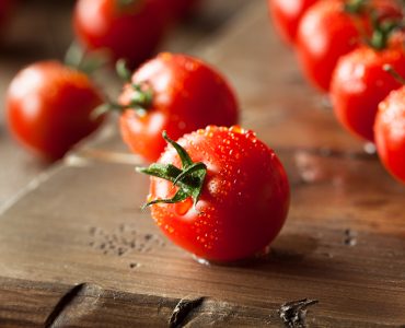 Raw Organic Red Cherry Tomatoes on the Vine