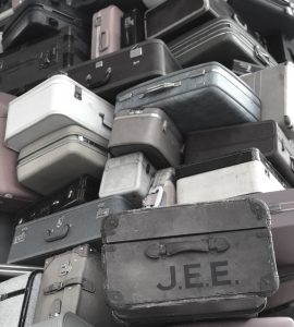 stack-of-suitcases-at-sacramento-ca-airport-muted