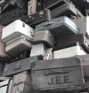 stack-of-suitcases-at-sacramento-ca-airport-muted